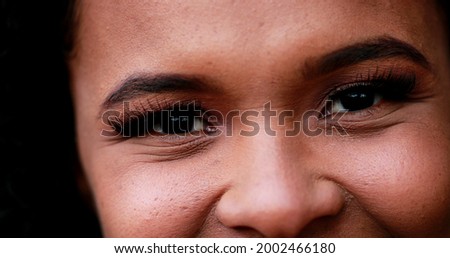 African mixed race young woman macro close-up face smiling