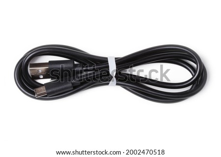 Black USB cable for charging a smartphone isolated on white Royalty-Free Stock Photo #2002470518