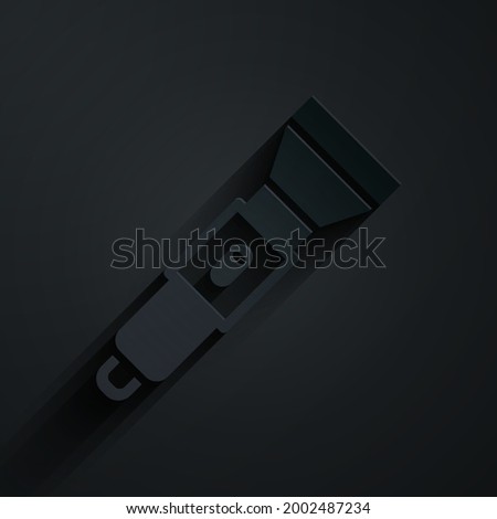 Paper cut Flashlight icon isolated on black background. Paper art style. Vector