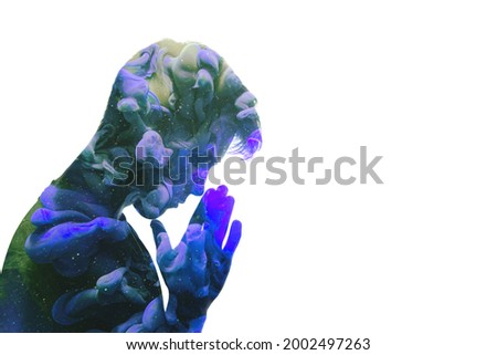 Inner peace. Mind freedom. Harmony balance. Meditation practice. Double exposure man praying silhouette with blue green colorful smoke cloud isolated on white copyspace background. Royalty-Free Stock Photo #2002497263