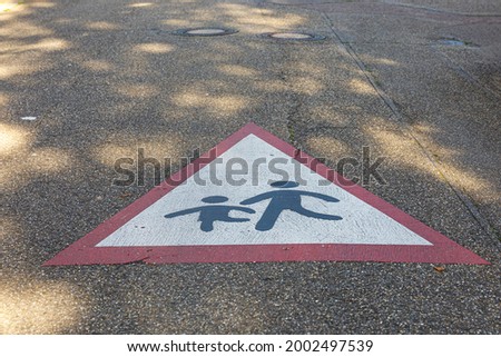 Warning sign on the street, caution pedestrians