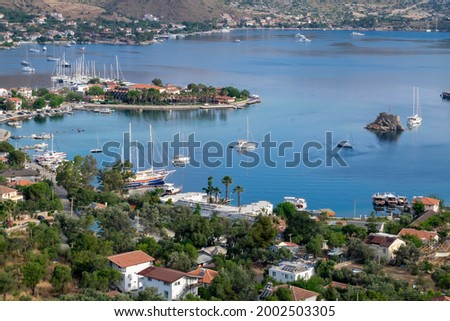 Selimiye village is world famous. It is a beautiful holiday center where large and small yachts and boats dock. A distant view of Selimiye. Muğla, Turkey. Royalty-Free Stock Photo #2002503305