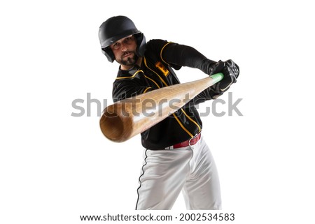 Close-up baseball player, pitcher in a black white sports uniform practicing isolated on a white studio background. Young sportsman in action. Competition, show, movement and team sport concept.