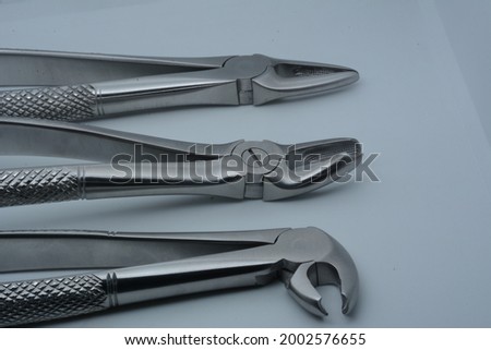 Dental extraction forceps for human dentition. They are made of stainless steel material. 