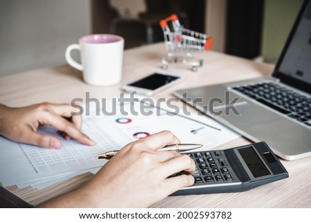 Business Accountant Woman Analysis Finance Accounting Budget Report at Her Office Desk. Professional Financial Manager Planning to Strategy and Account Cost Saving for Company Project Investment. 