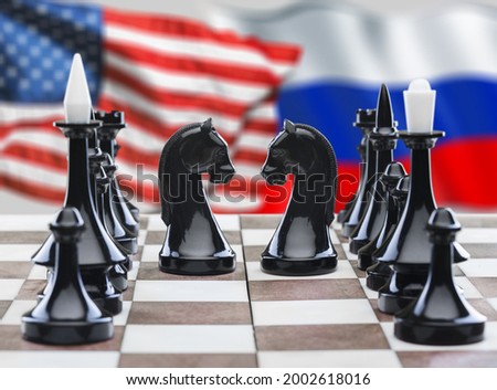 Russia vs USA, chess like geopolitics game. Flags of United States and Russian Federation and chessboard. Royalty-Free Stock Photo #2002618016