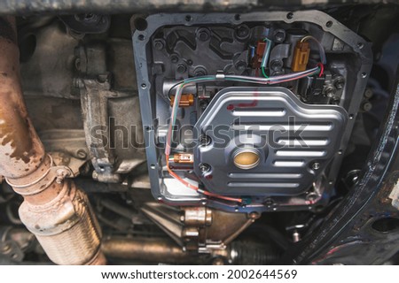 Automatic Transmission Service by Change Automatic Transmission Filter and Fluid. Royalty-Free Stock Photo #2002644569