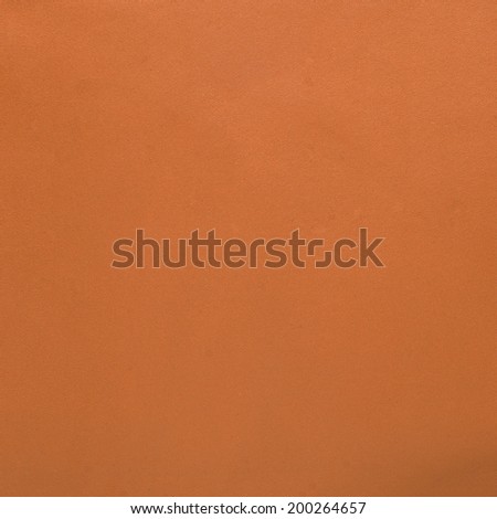 Orange leather texture closeup background.