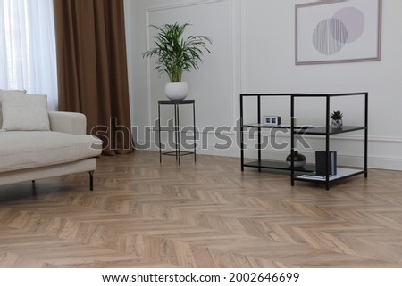 Modern living room with parquet flooring and stylish furniture Royalty-Free Stock Photo #2002646699