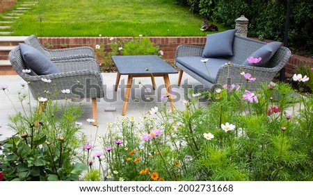 Garden seating next to the flower border