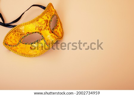 Carnival mask on color background. Purim celebration concept (jewish carnival holiday). Masquerade party or celebration concept.