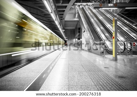 interior of a modern station, blurred train Royalty-Free Stock Photo #200276318