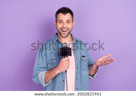 Photo of young man happy positive smile journalism reportage tell news microphone isolated over purple color background Royalty-Free Stock Photo #2002825961