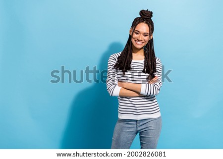 Photo of young african girl happy positive smile confident crossed hands isolated over blue color background