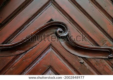 Carved detail of an old antique door, the entrance to a historic building in Weiden in der Oberpfalz, Germany. Royalty-Free Stock Photo #2002848977