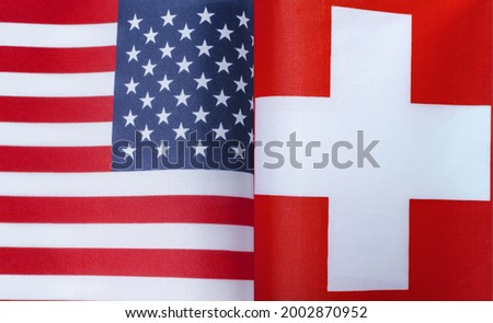 fragments of the national flags of the United States and Switzerland in close-up