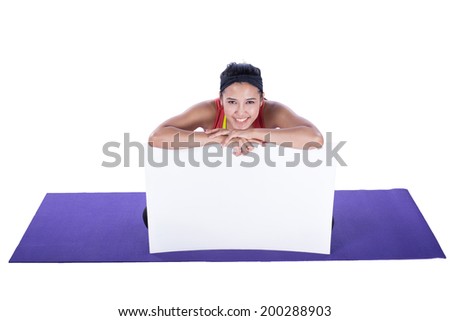 asian woman doing yoga and showing blank signboard isolated on white background