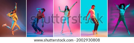 Jumping, dancing. Collage of five young men and women moving cheerfully isolated on colored backgrounds in neon light. Concept of fashion, beauty, youth culture, facial expressions. Concept of ad. Royalty-Free Stock Photo #2002930808