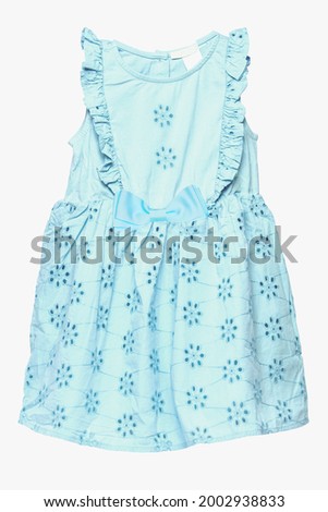 Summer dress isolated. Closeup of a beautiful light blue sleeveless baby girl dress isolated on a white background. Clipping path. Children spring fashion.
