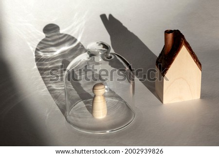 A person under transparent cap isolated from others at home Royalty-Free Stock Photo #2002939826