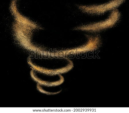 Wheat flour tornado isolated on black background Royalty-Free Stock Photo #2002939931