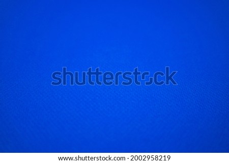 Navy, Blue football jersey clothing fabric texture sports wear background, close up. Sport Clothing Fabric Texture Background. Top View of Cloth Textile Surface. Navy, Blue Football Shirt. 