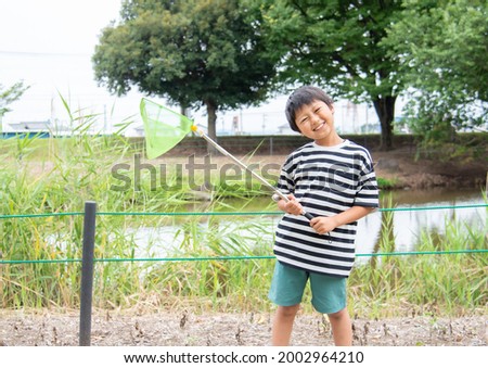 Elementary school boy with a net