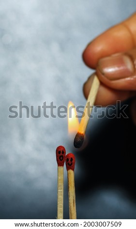 Two Romantic Matchsticks Burning In Love. Love And Romance Concept. Matchstick art photography used matchsticks to create a love concept. Close-up of burnt matchsticks.