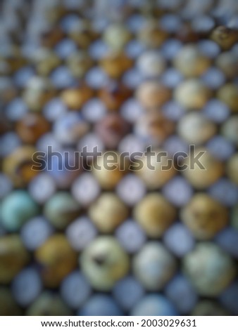 defocused abstract of quail eggs at paper tray