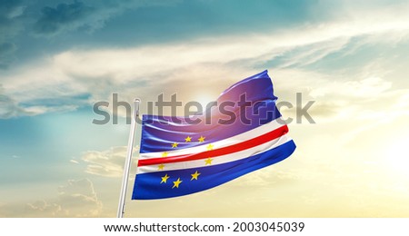 Cabo Verde national flag waving in beautiful clouds.