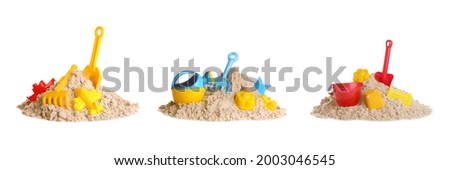 Plastic beach toys on piles of sand against white background, collage. Outdoor play Royalty-Free Stock Photo #2003046545