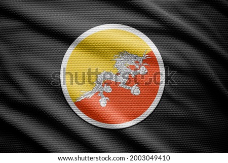 Bhutan flag isolated on black background. National symbols of Bhutan.