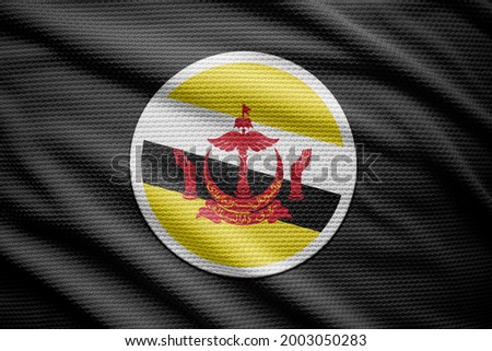 Brunei flag isolated on black background. National symbols of Brunei.