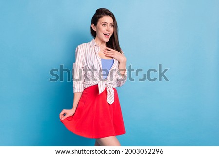 Portrait of attractive cheerful amazed feminine girlish girl good news reaction isolated over bright blue color background