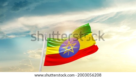 Ethiopia national flag waving in beautiful clouds.