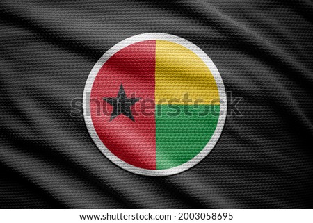 Guinea Bissau flag isolated on black background. National symbols of Guinea Bissau.