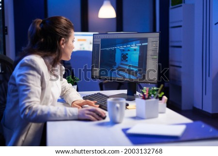 Editor developing new movie project, editing audio film montage sitting in production office late at night. Creative content creator using professional computer, modern technology, network wireless Royalty-Free Stock Photo #2003132768