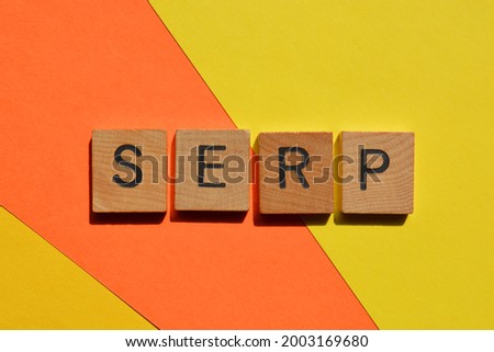 SERP acronym for Search Engine Results Page in wooden alphabet letters isolated colorful background