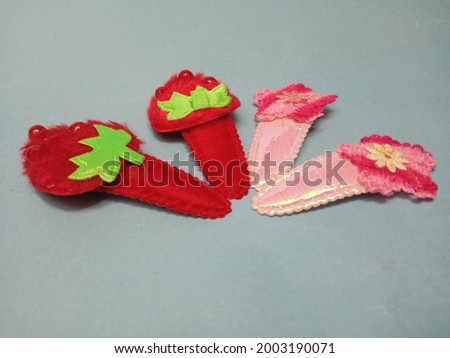 Strawberry and star shaped hair clip.
