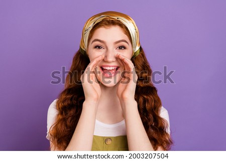 Photo of cheerful young happy lady hold hands face mouth announce news isolated on purple color background