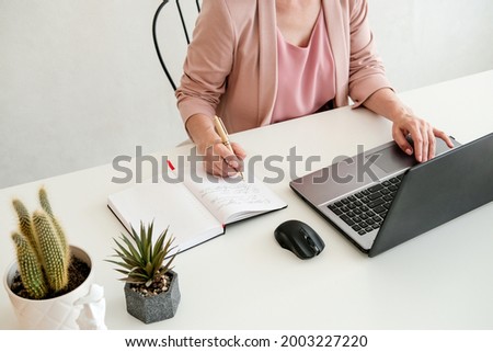 Woman hand typing on computer keyboard closeup. Business woman working at home. Online shopping concept 