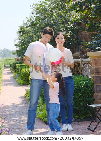 Happy family of three in the outdoor group photo high quality photo