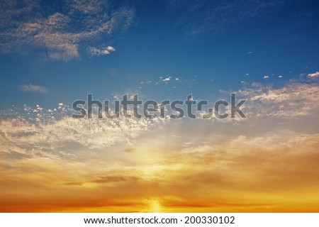 Sunrise with clouds on blue sky