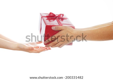 Hands giving and receiving a present