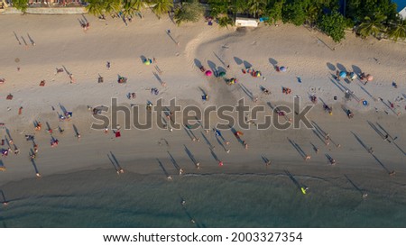 Aerial photography of Many of Tourists are waiting for sunsets on kata beach in Phuket, Thailand.