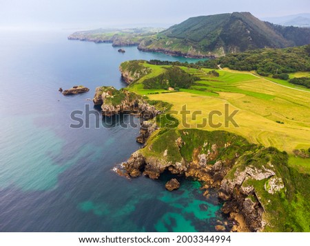 Aerial photos of the coast of the Cantabrian Sea in the north of Spain. In it you can see the coast and the meadows that next to the cliffs. The photos were taken in the town of Pechón.