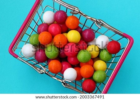 colored gum balls in a basket
