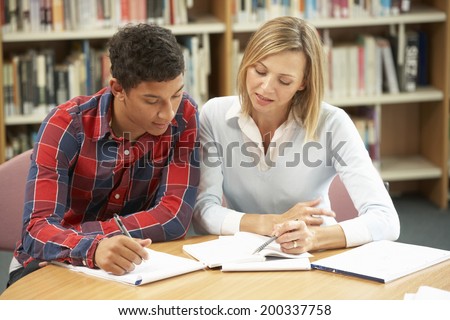 College tutor with student Royalty-Free Stock Photo #200337758