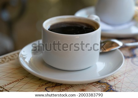 Fresh hot coffee on table in cafe interior 