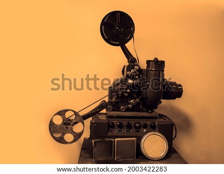movie camera without a tripod. The motion picture camera image. isolated on white wall background.  Royalty-Free Stock Photo #2003422283